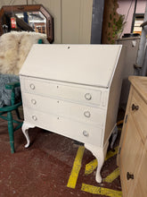 Load image into Gallery viewer, A charming mahogany bureau finished in crisp white, featuring a pull-down writing desk and three spacious dovetail-jointed drawers for generous storage. The piece shows character from its previous life, with the white finish displaying natural wear so would benefit from a repaint especially to the back legs. Ideal for adding functional elegance to a bedroom, study, or living space.
Delivery Available
Overall Dimensions
76cm wide x 41cm deep x 98cm high