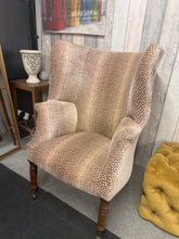 Load image into Gallery viewer, A striking 19th-century chimney back arm chair, expertly reupholstered in luxurious velvet leopard print. Sits on castors for effortless repositioning, this bold statement piece brings vintage character and contemporary flair to any room. An eye-catching focal point for the discerning collector.
Delivery Available
Overall Dimensions
approx : 76cm wide x 70cm deep x 110cm high