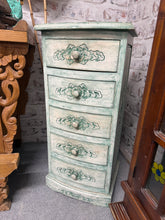 Load image into Gallery viewer, These striking green painted drawers make a bold statement in any room. Structurally sound and in excellent condition, this piece features five shallow drawers offering practical storage without compromising on style. The vibrant finish transforms it into a focal point that adds character and colour to bedrooms, living spaces, or hallways. Perfect for displaying decorative items or storing everyday essentials while making a design impact.
Delivery Available
Overall Dimensions
41.5cm wide x 35cm deep x 89