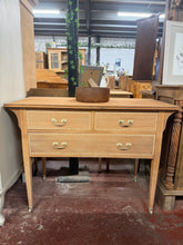 Load image into Gallery viewer, A charming mahogany chest of drawers, stripped to reveal its natural grain and patina. Features two short dovetail-jointed drawers above one generously sized long drawer, offering practical storage. The piece displays character marks and fine surface cracks consistent with vintage furniture. Bare wood finish allows for personalisation — consider a protective wax coat to enhance the natural colour and safeguard the timber. Ideal for period interiors or those seeking authentic, pre-finished pieces with herita