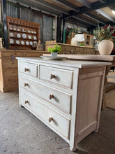 Load image into Gallery viewer, A charming distressed chest of drawers crafted from satinwood and finished with an elegant white-wash distressed effect. Featuring solid construction with 2 short dovetail-jointed drawers over 2 generous long drawers, providing ample storage for bedroom essentials. The weathered aesthetic creates a distinctive focal point, blending vintage character with practical functionality. Ideal for adding rustic elegance to any bedroom.
Delivery Available
Overall Dimensions
106cm wide x 45.5cm deep x 71cm high