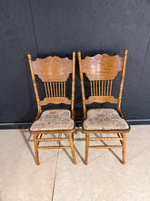 Load image into Gallery viewer, A handsome pair of American pine dining chairs with solid construction and authentic character. Each chair shows the patina of gentle use with minor surface marks that add to their vintage appeal. Structurally sound and ready for your table. Perfect for those seeking genuine vintage pieces with history and charm.
Delivery Available
Overall Dimensions
approx : 46cm wide x 43cm deep x 109cm high