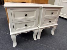 Load image into Gallery viewer, A matching pair of white bedside tables, both in sound working condition. Each unit features two practical drawers for storage. One table shows minor edge wear that does not impact functionality. Ideal for completing a bedroom set or as individual accent pieces.
Delivery Available
Overall Dimensions
35cm wide x 31cm deep x 50cm high
