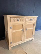 Load image into Gallery viewer, A characterful vintage sideboard. Two shallow drawers sit above a spacious double cupboard featuring an internal shelf—ideal for storing tableware, linens, or display pieces. The piece is structurally sound and ready for refinishing. Veneer on the sides shows wear consistent with age and use. Perfect for collectors seeking authentic mid-century storage with potential for restoration.
Delivery Available
Overall Dimensions
95cm wide x 48cm deep x 89cm high