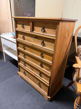 Load image into Gallery viewer, This charming pine chest of drawers combines practical storage with timeless appeal. Featuring two short drawers positioned above five generous long drawers, it offers ample space for bedroom essentials or living room organisation. Built to last, the piece is structurally sound and well-maintained, with only minor cosmetic wear that adds to its authentic character. Ideal for those seeking quality furniture with vintage charm and everyday functionality.
Delivery Available
Overall Dimensions
80cm wide x 46