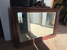 Load image into Gallery viewer, This exquisite ornate mahogany mirror brings timeless elegance to any interior. Crafted from quality mahogany with intricate detailing, it showcases authentic period character and charm. The piece is structurally sound and in good overall condition, with minor surface marks consistent with use. An ideal statement piece for traditional, eclectic, or classic décor schemes seeking genuine vintage appeal.
Delivery Available
Overall Dimensions
85cm wide x 70cm high 
