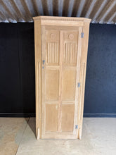 Load image into Gallery viewer, A characterful stripped oak wardrobe with authentic vintage patina. This piece has been returned to its natural wood finish and shows honest signs of age—minor marks and veneer wear that doesn't affect functionality. Inside, you'll find one shelf, a hanging rail, and multiple hooks for versatile storage. A protective coat of wax is recommended to enhance and preserve the wood.
Delivery Available
Overall Dimensions
81cm wide x 40cm deep x 183cm high