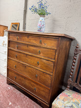Load image into Gallery viewer, This exceptional 19th-century mahogany chest of drawers combines timeless elegance with practical storage. Structurally sound and well-preserved, it bears the gentle patina of age with only minor marks that enhance its authentic character. Five dovetail-jointed graduating drawers provide generous storage capacity, while the quality craftsmanship and rich mahogany finish make it a distinguished addition to any bedroom or hallway.
Delivery Available
Overall Dimensions
112cm wide x 56cm deep x 110cm high