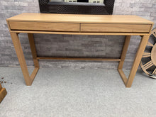 Load image into Gallery viewer, A charming dressing table that blends timeless style with practical functionality. It has minor signs of use but nothing major. Two generous drawers provide convenient storage for your essentials, making it both a decorative and hardworking addition to any bedroom.
Delivery Available
Overall Dimensions
140cm wide x 40cm deep x 85cm high     