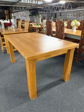 Load image into Gallery viewer, This oak dining table is surprisingly solid and in good overall shape. One plank has moved slightly, giving the appearance of a crack, but it doesn’t impact how the table functions. Comfortable enough to seat 6 to 8 people, it’s great for family meals and gatherings. The legs are fixed and cannot be detached.
Overall Dimensions
156cm long x 91cm wide x 79cm high
DELIVERY AVAILABLE      
For our other items see our website https://fossewayfurniture.co.uk
collection from our shop at CV36 4QZ or purchase