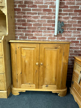 Load image into Gallery viewer, A characterful solid pine cupboard with genuine vintage appeal. This sturdy storage piece features two internal shelves, offering practical space for books, crockery, or household items. The surface shows honest wear and patina — perfect for those who appreciate authentic period furniture or enjoy a restoration project. Light sanding or a fresh coat of paint would easily refresh its appearance and complement any interior style. A solid, functional piece with real bones and potential.
Delivery Available
Ov