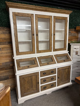 Load image into Gallery viewer, This beautiful two-tone dairy dresser is sturdy and well-preserved. It offers plenty of storage, featuring two shelves in the upper section, three hatches, three drawers, and two single cupboards each with a shelf inside. It conveniently separates into two parts for easier transport and includes all the original keys.
Overall Dimensions
163cm wide x 52cm deep x 212.5cm high
DELIVERY AVAILABLE      
For our other items see our website https://fossewayfurniture.co.uk
collection from our shop at CV36 4QZ