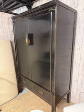 Load image into Gallery viewer, A striking black Oriental-style wardrobe combining timeless design with practical storage. This piece is structurally sound and in good overall condition, with the character marks that come with pre-loved furniture. Features one hanging rail for garments and two dovetail-jointed drawers for folded items and accessories. Ideal for adding authentic style to any bedroom whilst maximising storage space.
Delivery Available
Overall Dimensions
110cm wide x 58.5cm deep x 180cm high