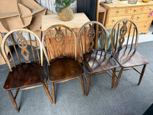 Load image into Gallery viewer, This charming set of four Ercol dining chairs combines classic design with practical durability. Each chair is structurally sound and in good overall condition, bearing the gentle patina of age with only minor surface marks. Ideal for period properties, cottages, and homes seeking authentic vintage character, these chairs bring timeless appeal to any dining space.
Delivery Available
Overall Dimensions
approx : 40cm wide x 40cm deep x 83cm high 
