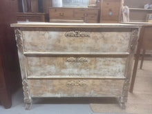 Load image into Gallery viewer, This beautiful, solid wooden chest of drawers features a charming distressed look and offers three spacious long drawers for ample storage. This piece is structurally stable and remains in great condition, showing only a few minor marks.
Overall Dimensions
99.5cm wide x 44cm deep x 80cm high
DELIVERY AVAILABLE      
For our other items see our website https://fossewayfurniture.co.uk
collection from our shop at cv36, our collection zone at bs36 or otherwise delivery is available