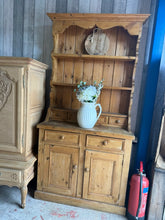 Load image into Gallery viewer, This charming vintage pine dresser combines character with practicality. Structurally sound and in good overall condition, it shows honest signs of age and use. One door has a minor crack—easily repaired. The generous storage includes two shelves and two drawers in the upper section, with two additional drawers and a double cupboard below. Delivered as one complete piece, it's an ideal addition to period homes or eclectic interiors seeking authentic vintage appeal.
Delivery Available
Overall Dimensions
1