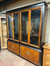 Load image into Gallery viewer, This beautiful large oriental style dresser is sturdy and well-maintained overall. It shows some minor marks, but nothing significant. The dresser splits into two parts for easier transport. The upper section features six glass shelves, while the base includes two cupboards, each with a single shelf inside. All missing handles are included and simply need to be reattached.
Overall Dimensions
183cm wide x 42cm deep x 211cm high
DELIVERY AVAILABLE
For our other items see our website https://fosseway