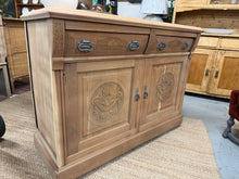 Load image into Gallery viewer, A beautiful stripped satinwood sideboard, restored to its natural wood finish. Features two dovetail-jointed drawers above two single cupboards, each with internal shelving for organised storage. The piece displays authentic character with minor marks and a crack to one side—neither affecting functionality. Bare wood may benefit from a protective wax coat to enhance durability and appearance. An elegant addition to period or contemporary interiors.
Delivery Available
Overall Dimensions
122cm wide x 50cm