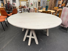 Load image into Gallery viewer, This spacious round dining table seats 8–10 guests comfortably, making it ideal for family gatherings and entertaining. The whitewashed finish brings warmth and character to any dining space. Structurally sound with minor cosmetic marks consistent with pre-loved furniture, it shows authentic patina. Removable legs simplify transport and repositioning. A substantial, striking centrepiece for your home.
Delivery Available
Overall Dimensions
180cm diameter x 77cm high