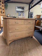 Load image into Gallery viewer, This beautiful stripped oak chest of drawers showcases the wood's natural grain and character. Featuring two dovetail-jointed drawers above two larger storage drawers, it offers practical storage with traditional craftsmanship. The piece has been stripped back to bare wood, revealing its authentic appeal—a light coat of wax will enhance protection and bring out the oak's warmth. Structurally sound and in excellent condition, it's ready to become a focal point in any room.
Delivery Available
Overall Dimens