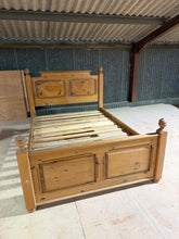 Load image into Gallery viewer, A charming pre-owned pine double bed with solid structural integrity. Features the character of vintage furniture with minor surface marks that reflect its history. Accommodates a standard 4ft 6 mattress. Ideal for those seeking natural wood elegance with authentic character and excellent value.
Delivery Available
Overall Dimensions
150cm wide x 206cm long
headboard height : 128cm
footboard height : 79cm 