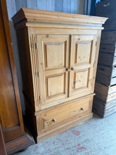 Load image into Gallery viewer, This lovely solid pine wardrobe for children is sturdy and well-maintained. While it shows some signs of use, these are minor and don’t detract from its charm. It features plenty of storage space with a hanging rail, a removable shelf, and a spacious dovetail jointed drawer. This does come into 2 for easier moving.
Overall Dimensions
100cm wide x 60cm deep x 144.5cm high
DELIVERY AVAILABLE      
HAVE THIS PAINTED A COLOUR OF YOUR CHOICE FOR AN EXTRA £80 OR HAVE IT COMPLETELY STRIPPED BACK FOR JUST £90