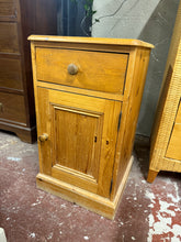 Load image into Gallery viewer, A charming solid pine bedside table in structurally sound condition. Features one practical drawer positioned above a single cupboard with an internal shelf, offering convenient storage for bedside essentials. As a pre-loved piece, it bears gentle signs of use that add to its character, with no significant damage. Ideal for adding warmth and functionality to any bedroom.
Delivery Available
Overall Dimensions
43cm wide x 43cm deep x 75cm high