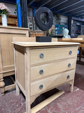 Load image into Gallery viewer, This beautiful oak chest of drawers showcases natural wood grain after being stripped back to bare timber. The three spacious dovetail-jointed drawers offer generous storage, whilst the solid construction ensures lasting durability. In good structural condition, it's ready for finishing with wax or oil to suit your décor. A versatile piece that brings warmth and character to any bedroom or living space.
Delivery Available
Overall Dimensions
83cm wide x 45cm deep x 76cm high + 6cm for the plinth