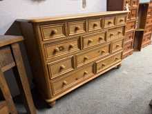 Load image into Gallery viewer, A characterful solid pine merchant's chest with period appeal. This structurally sound piece features 13 dovetail-jointed drawers across three sizes—perfect for generous storage in bedroom, hallway, or study. Shows pleasing signs of age and use; ideal for refinishing with paint or natural wood treatment to suit your décor. Versatile vintage storage that brings both function and charm to any room.
Delivery Available
Overall Dimensions
131cm wide x 50cm deep x 87cm high