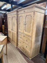 Load image into Gallery viewer, This exceptional ornate oak wardrobe showcases beautiful natural grain after careful stripping, revealing the wood's authentic character. A protective wax finish is recommended to enhance durability. Minor trim details are absent, though barely perceptible. The generous interior combines a double cupboard, shelved compartment, pull-down shelved unit, and spacious drawer—ideal for comprehensive storage. A truly distinctive piece with genuine one-of-a-kind appeal.
Delivery Available
Overall Dimensions
224c