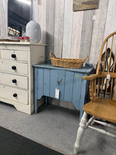 Load image into Gallery viewer, A beautiful solid pine cupboard combining rustic charm with practical storage. This characterful piece showcases an authentic distressed finish that adds vintage appeal to any room. Structurally sound and well-maintained, it offers generous internal storage space perfect for displaying collections or concealing everyday items. An ideal statement piece for farmhouse, country, or eclectic interiors.
Delivery Available
Overall Dimensions
74.5cm wide x 37cm deep x 72cm + 5cm high 