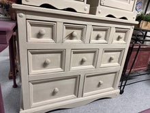 Load image into Gallery viewer, A charming solid pine chest of drawers finished in Farrow & Ball's 'String'—a soft, understated neutral that complements any interior. Nine versatile drawers (4 short, 3 medium, 2 long) provide generous storage for bedroom essentials or living space organisation. Structurally sound with a subtle distressed finish that enhances its vintage character and adds warmth to traditional or contemporary schemes.
Delivery Available
Overall Dimensions
101cm wide x 46cm deep x 81cm high