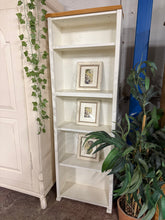 Load image into Gallery viewer, A charming two-tone narrow pine bookcase with authentic character. Structurally sound and built to last, this pre-loved piece is in overall good condition. Light wear marks and minor imperfections add to its vintage appeal—but nothing that detracts from its functionality or charm. Perfect for displaying books, décor, and treasured collections in bedrooms, studies, or living spaces where space is at a premium.
Delivery Available
Overall Dimensions
55cm wide x 25cm deep x 162cm + 2cm high