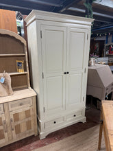 Load image into Gallery viewer, A charming double wardrobe in white that combines practicality with character. Featuring a sturdy hanging rail and two convenient drawers, it offers generous storage for your wardrobe essentials. While it bears the honest patina of pre-loved furniture—including minor surface marks and a side crack—these don't impact its functionality. The best part? It fully disassembles for hassle-free transport and repositioning. A reliable, spacious solution with plenty of life left to give.
Overall Dimensions
100cm wi