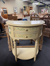 Load image into Gallery viewer, A beautifully hand-painted demi lune hall table combining classic style with practical storage. Structurally sound and in good condition, this piece features two generous drawers and a lower shelf—perfect for organising entryway essentials or displaying décor. Shows authentic vintage character with minor marks that add to its charm. An elegant accent piece for hallways, living rooms, or bedrooms.
Delivery Available
Overall Dimensions
75cm wide x 39cm deep x 84cm high