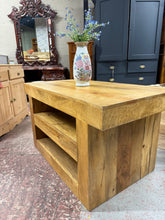 Load image into Gallery viewer, Crafted from mango wood, this coffee table combines practical storage with timeless appeal. Two spacious shelves offer convenient space for books, magazines, or decorative pieces. The solid construction ensures lasting durability, while its gently used patina adds authentic character to any living room. A versatile piece that brings both function and natural beauty to your home.
Delivery Available
Overall Dimensions
110cm wide x 60cm deep x 60cm high 