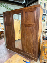 Load image into Gallery viewer, A classic triple mahogany wardrobe offering substantial storage across two sections. The double wardrobe features a hanging rail and two long drawers, whilst the single cupboard includes hooks and two drawers (one handle requires attention). Structurally sound with minor wear consistent with age and use. Dismantles for convenient transport and will arrive ready for assembly.
Delivery Available
Overall Dimensions
184cm wide x 56cm deep x 204cm high