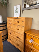 Load image into Gallery viewer, A timeless solid pine chest combining classic craftsmanship with practical storage. This piece features two short dovetail-jointed drawers over three spacious long drawers—ideal for bedrooms, hallways, or living spaces. Constructed from quality pine with authentic period character, it shows gentle signs of use that add to its vintage appeal. Structurally sound and ready for your home.
Delivery Available
Overall Dimensions
92cm wide x 43.5cm deep x 113cm high