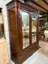 Load image into Gallery viewer, A classic mahogany wardrobe built to last, featuring robust construction with minor cosmetic wear that speaks to its character. Inside, you'll find practical storage across four hanging rails, convenient hooks for accessories, and two dovetail-jointed drawers for folded items. Designed with practicality in mind, it disassembles into four sections for straightforward transport and installation.
Delivery Available
Overall Dimensions
160cm wide x 55cm deep x 206cm high.