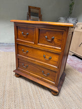 Load image into Gallery viewer, A characterful hardwood chest of drawers with solid construction and authentic patina. Features two short dovetail-jointed drawers above two generous long drawers, offering practical storage with traditional craftsmanship. Well-maintained and ready for use.
Delivery Available
Overall Dimensions
71cm wide x 40cm deep x 81cm high