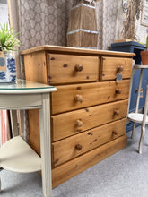Load image into Gallery viewer, A charming solid pine chest of drawers with authentic character. This well-maintained piece features two short drawers over three generous long drawers, offering practical storage for any room. The natural patina and minor marks reflect its vintage appeal, making it ideal for country, farmhouse, or rustic interiors. Structurally sound and ready to enhance your home with timeless style and functionality.
Delivery Available
Overall Dimensions
91cm wide x 46cm deep x 97.5cm high 
