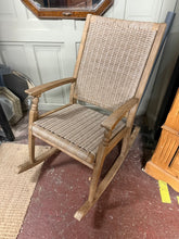 Load image into Gallery viewer, Crafted from teak wood, this rocking chair combines timeless style with practical versatility. Built to last, it features a sturdy construction suitable for both indoor and outdoor spaces. The natural patina and minor surface marks add character while maintaining structural integrity. Perfect for creating a relaxing spot on your patio, garden, or living room—ideal for unwinding with a book or enjoying peaceful moments.
Delivery Available
Overall Dimensions
approx : 58cm wide x 98cm deep x 100cm high&nbsp