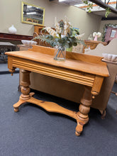 Load image into Gallery viewer, This charming Victorian pine washstand combines authentic period character with practical functionality. Structurally sound and in good overall condition, it bears the gentle patina of age with minor surface marks that add to its vintage appeal. Features a single front drawer offering convenient storage. Versatile enough to serve as a hallway table, bathroom vanity, or decorative accent piece in any room seeking period charm.
Delivery Available
Overall Dimensions
105cm wide x 45cm deep x 73cm / 82cm high