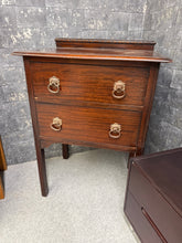 Load image into Gallery viewer, A charming mahogany chest of drawers with solid construction and timeless appeal. This compact piece features two spacious dovetail-jointed drawers, offering reliable storage. Well-maintained with minor patina marks that add character. Ideal for bedrooms, hallways, or living spaces seeking vintage furniture with genuine quality and durability.
Delivery Available
Overall Dimensions
61cm wide x 44cm deep x 87cm high