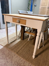 Load image into Gallery viewer, This solid pine console table combines timeless charm with practical functionality. Crafted from quality pine, it features sturdy construction and a single dovetail-jointed drawer offering discreet storage. Ideal for hallways, entryways, or living spaces, it brings warmth and character to any room whilst providing a convenient surface for keys, post, and everyday essentials.
Delivery Available
Overall Dimensions
83cm wide x 39cm deep x 74cm high 