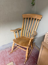 Load image into Gallery viewer, A charming solid pine rocking chair with authentic character. Structurally sound and in good condition, this gently used piece bears the natural patina of age. Ideal for creating a cosy fireside retreat or adding rustic warmth to any room. Minor marks reflect its history and charm.
Delivery Available
Overall Dimensions
approx : 67cm wide x 80cm deep x 108cm high