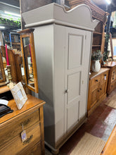 Load image into Gallery viewer, Substantial solid pine wardrobe finished in Farrow & Ball's 'London stone' – a soft, sophisticated neutral that complements any bedroom scheme. Features a single hanging rail for generous storage and a removable top design for stress-free moving and repositioning. Shows minor surface marks consistent with vintage furniture, adding character and patina. Ideal for those seeking quality, timeless storage with practical functionality. There are a few marks but nothing major.
Delivery Available
Overall Dim