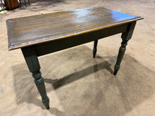 Load image into Gallery viewer, A charming wooden dining table with character and vintage appeal. Featuring distinctive green distressed legs and a solid structural foundation, this piece brings rustic warmth to any dining space. The tabletop shows warping , though when secured to the base, you may not notice too much.
Delivery Available
Overall Dimensions
110cm wide x 62cm deep x 74.5cm high