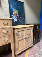 Load image into Gallery viewer, Authentic stripped oak cupboard returned to its natural finish, showcasing warm wood grain and character. Structurally sound and ready for use, though a protective coat of wax is recommended to enhance durability and appearance. Features a spacious pull-out drawer for convenient storage. Perfect for adding rustic charm and functionality to any room.
Delivery Available
Overall Dimensions
63cm wide x 42cm deep x 72.5cm high