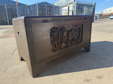 Load image into Gallery viewer, This expertly crafted carved wooden blanket box is sturdy and in excellent condition. While there are a few minor blemishes, they do not detract from the piece's overall quality. The box offers generous storage space for a variety of items including blankets.
Overall Dimensions
102cm wide x 52cm deep x 59cm high
DELIVERY AVAILABLE    
For our other items see our website https://fossewayfurniture.co.uk
collection from cv36 or delivery available